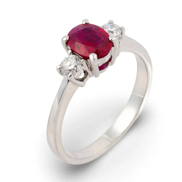 Vintage three-stone ring with a center ruby and two side diamonds